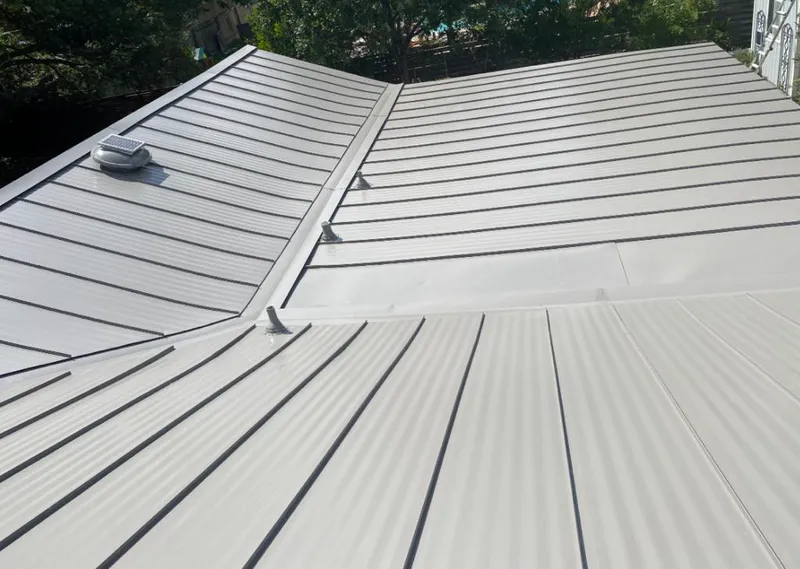 Solar attic fan installed on a metal roof for Roof Ventilation in Zionsville